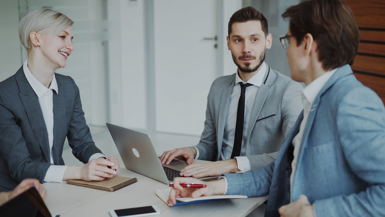 Business team reviewing plans in a meeting
